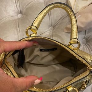 Brand new Rebecca Minkoff gold leather cross body bag.  Excellent condition